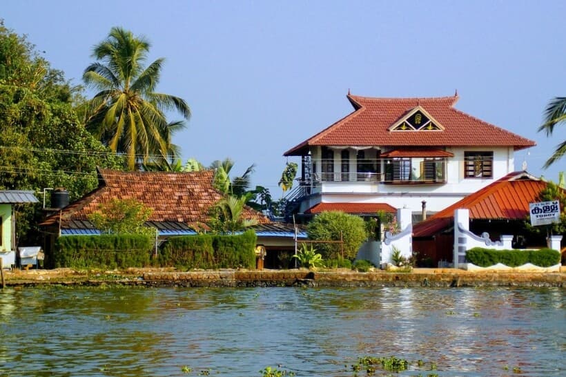 Alleppey Kerala backwaters with traditional houseboats during Ayurveda wellness tour in India