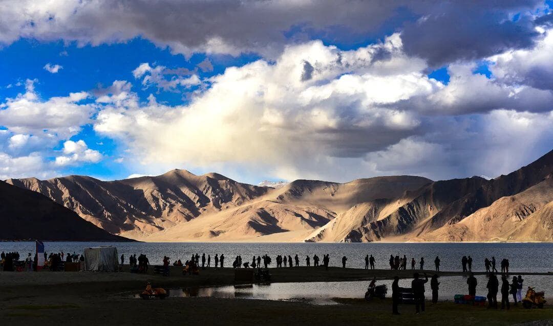 Pangong Lake Ladakh with crystal-clear blue waters and dramatic Himalayan mountains