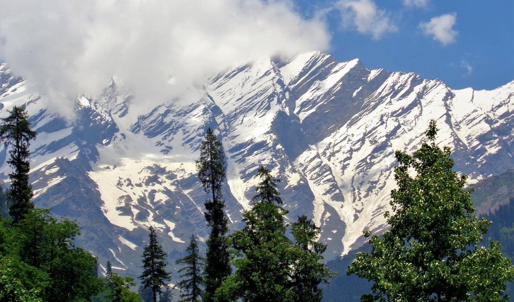 Manali hill station with snow covered mountains lush valleys and Himalayan landscapes