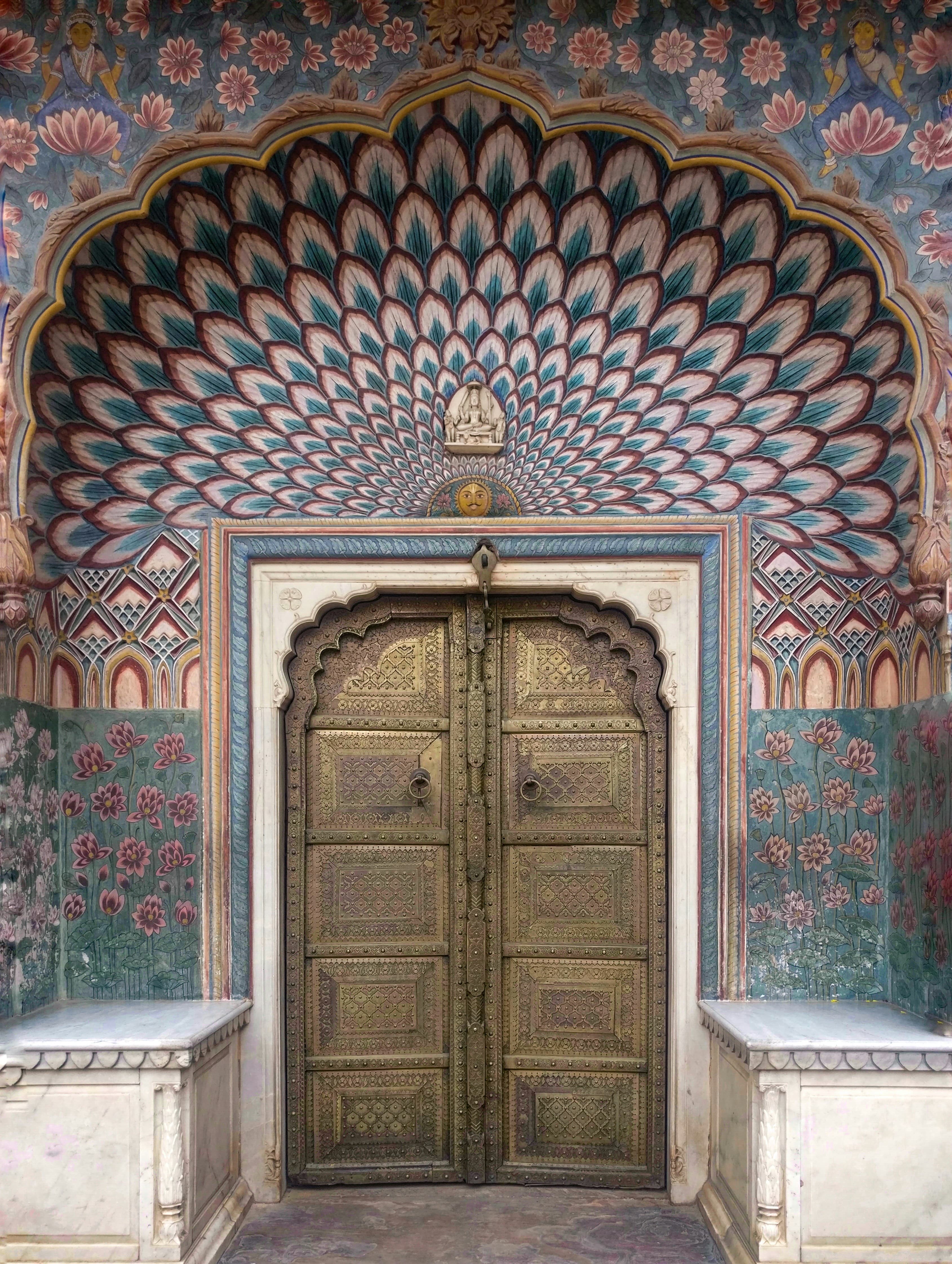 Decorative doorway inside Jaipur City Palace featuring traditional artwork
